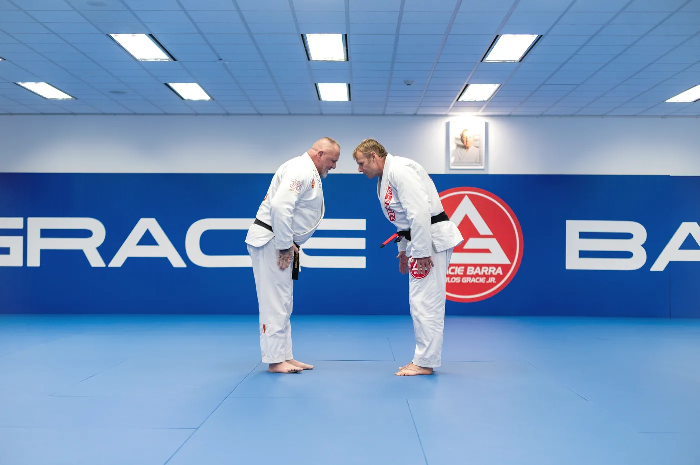 Two adult students bowing before a Jiu-Jitsu session at Gracie Barra Holbrooks