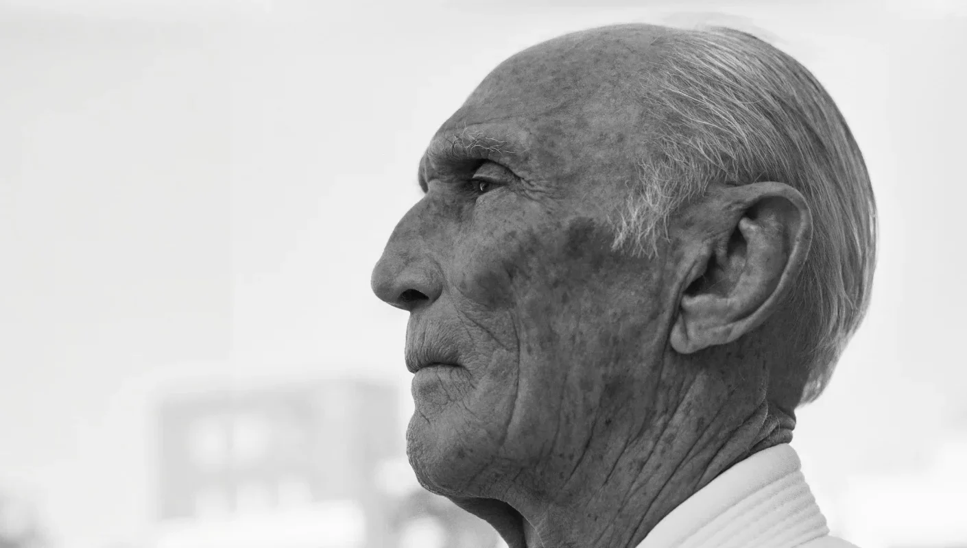 Helio Gracie in later life, in profile, wearing a gi
